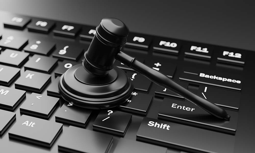 Law gavel over black keyboard